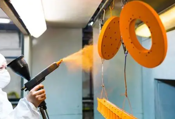 How can powder coatings be precisely applied to a workpiece?